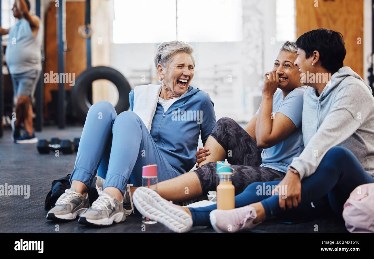 Gym, laughing and group of mature women telling joke after fitness