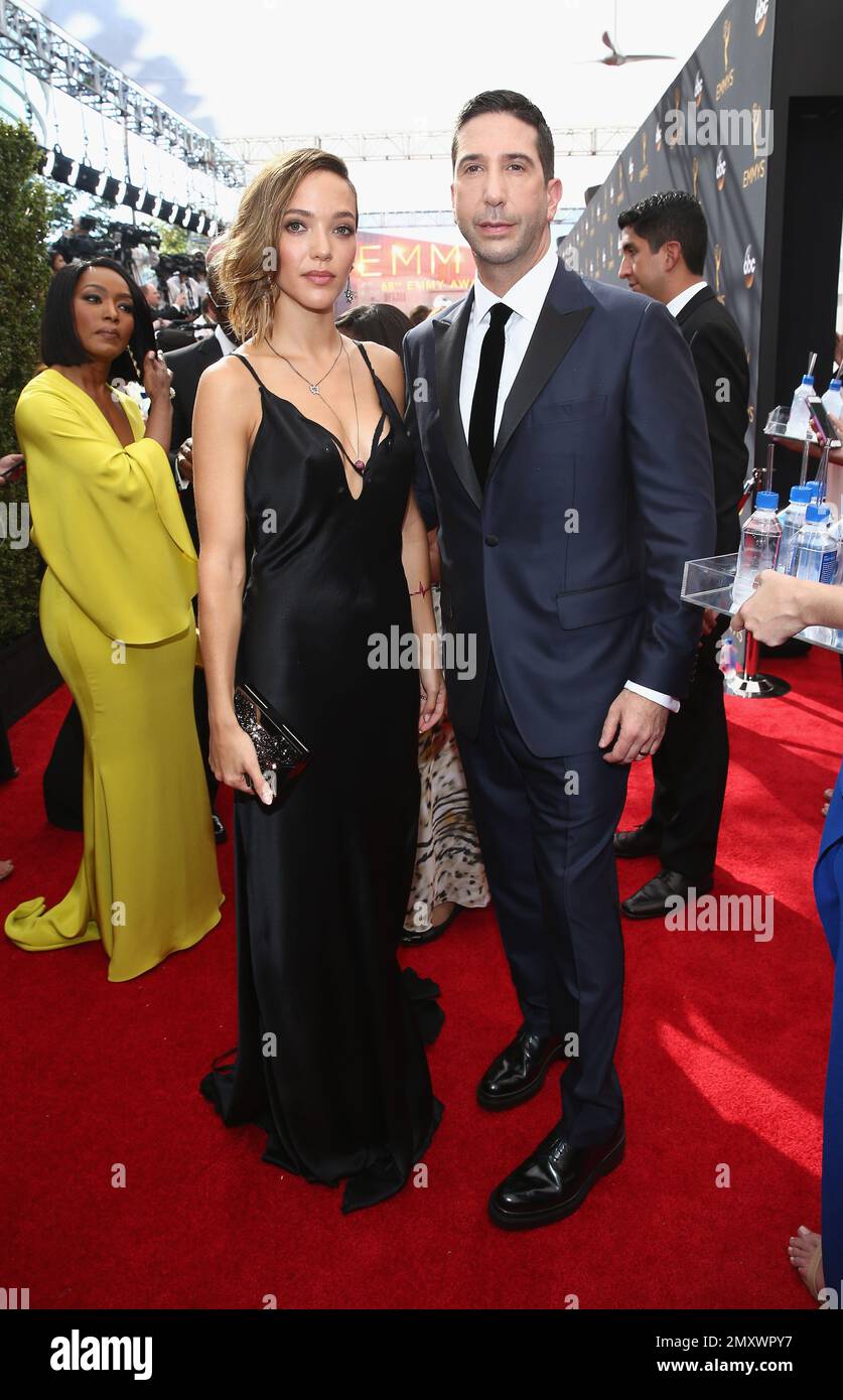 Zoe Buckman, left, and David Schwimmer arrive at the 68th Primetime