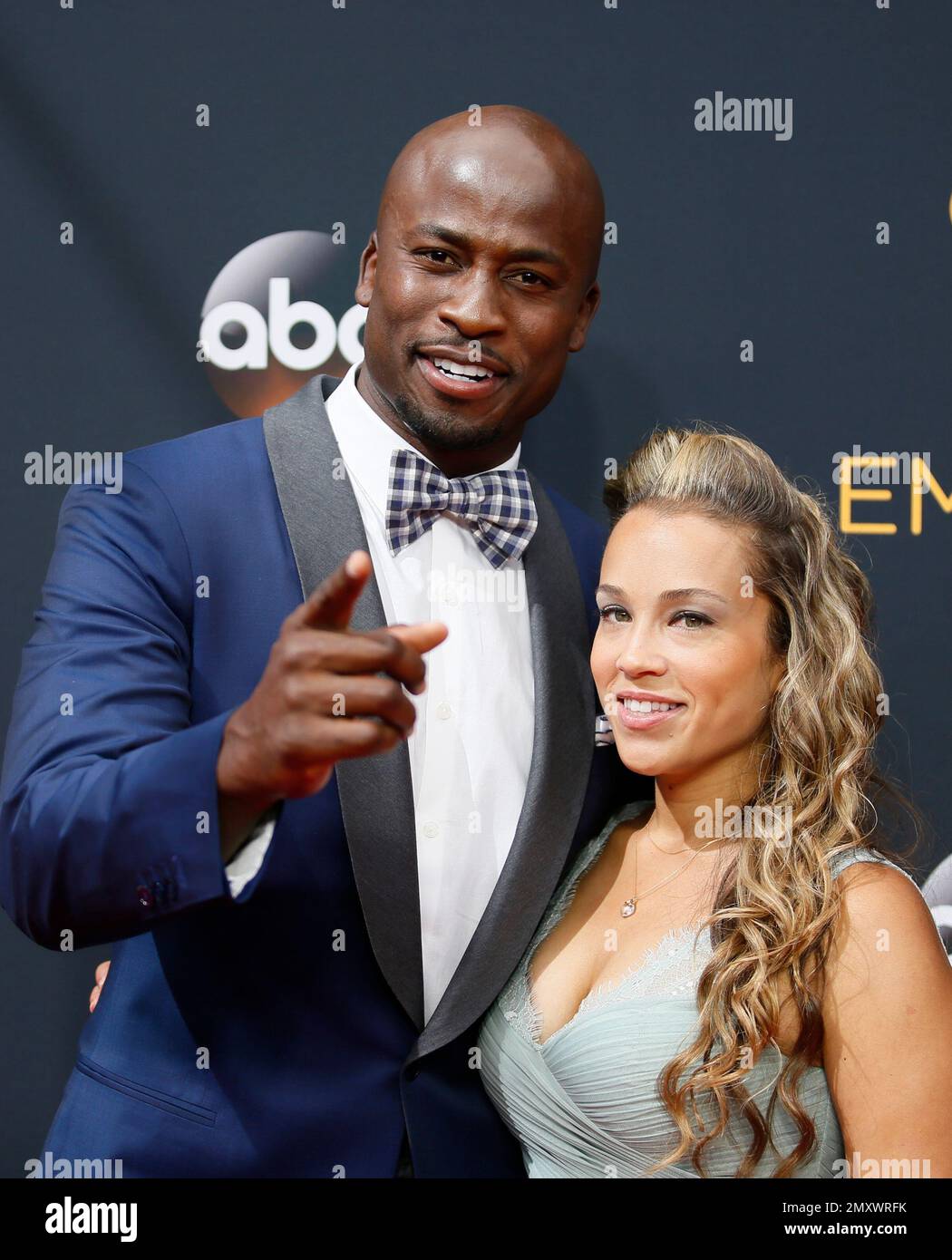 Akbar Gbaja-Biamila, left, and Chrystal Gbaja-Biamila arrive at the