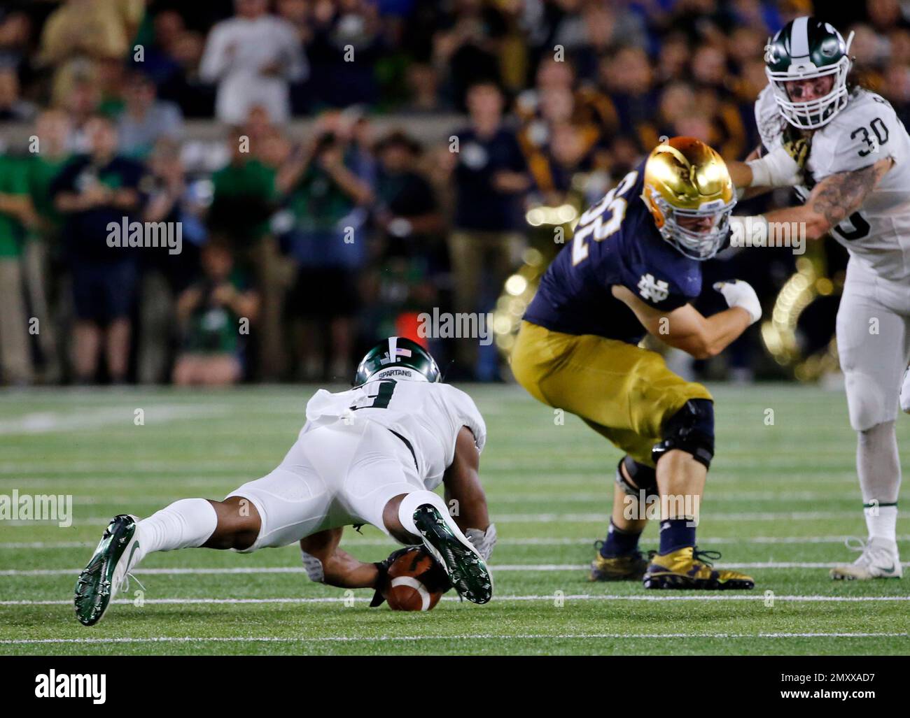 Michigan State safety Montae Nicholson (9) recovers a fumble during the