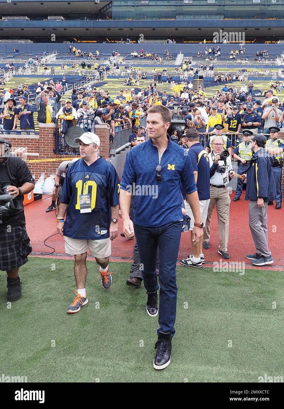 Michigan quarterback Tom Brady (10) stands on the field during a NCAA  football game against Indiana in Bloomington, Indiana on Saturday, October  30, 1999. The Michigan Wolverines defeated the Indiana Hoosiers 34-31. (