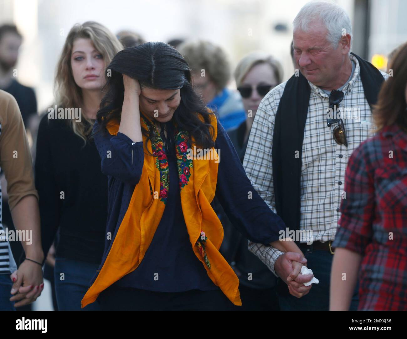 Amanda MacTaggart, left, joins her mother, Melissa, center, and father