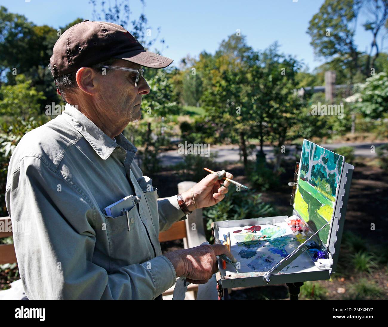 Artist Richard Rabkin works on a painting inside the newly-opened ...