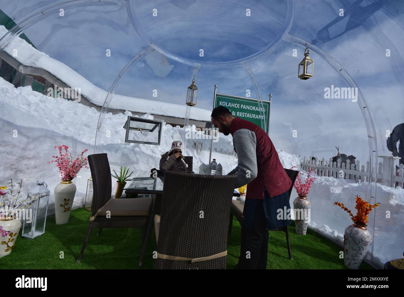 Srinagar, India. 04th Feb, 2023. Chef serving people in glass igloo