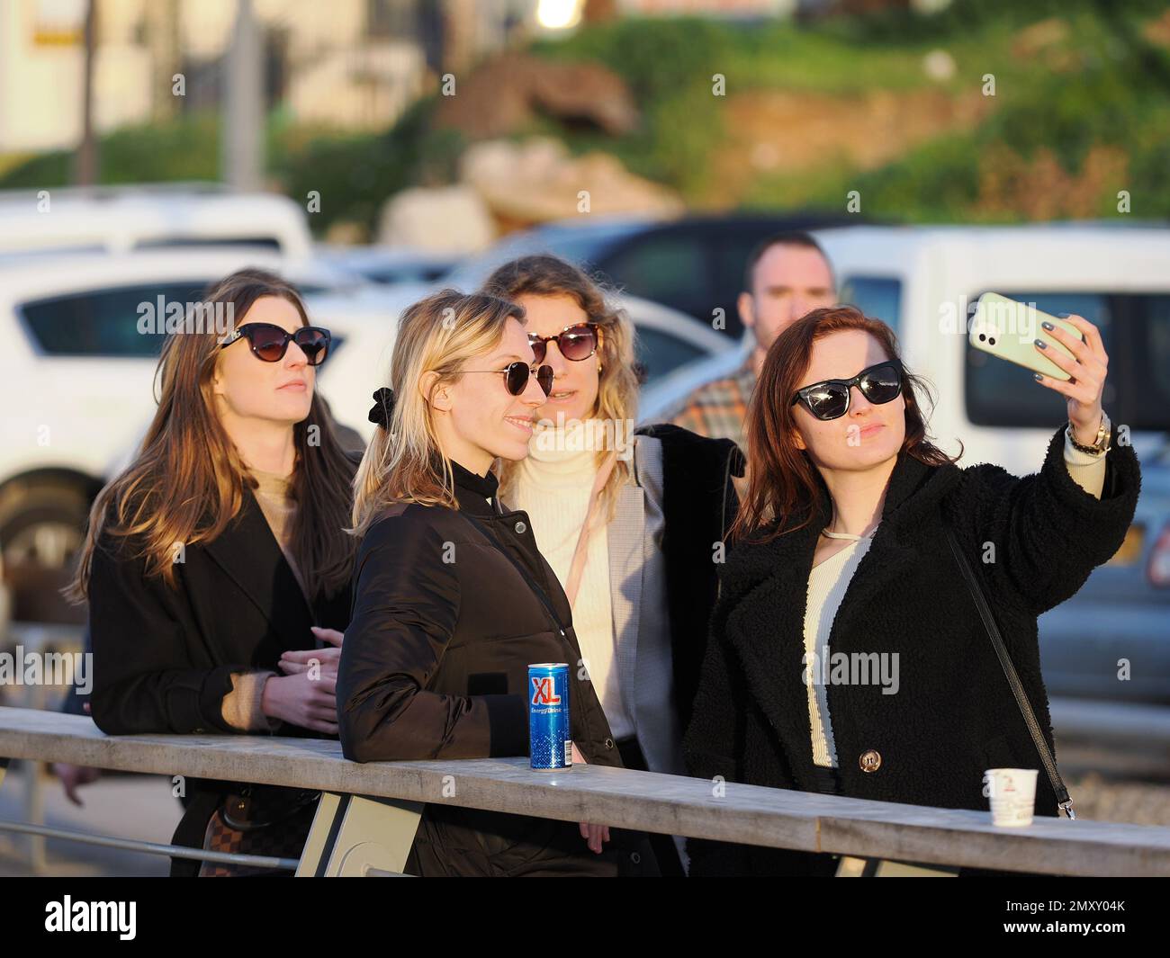Four young girls take a selfie on the street Stock Photo - Alamy