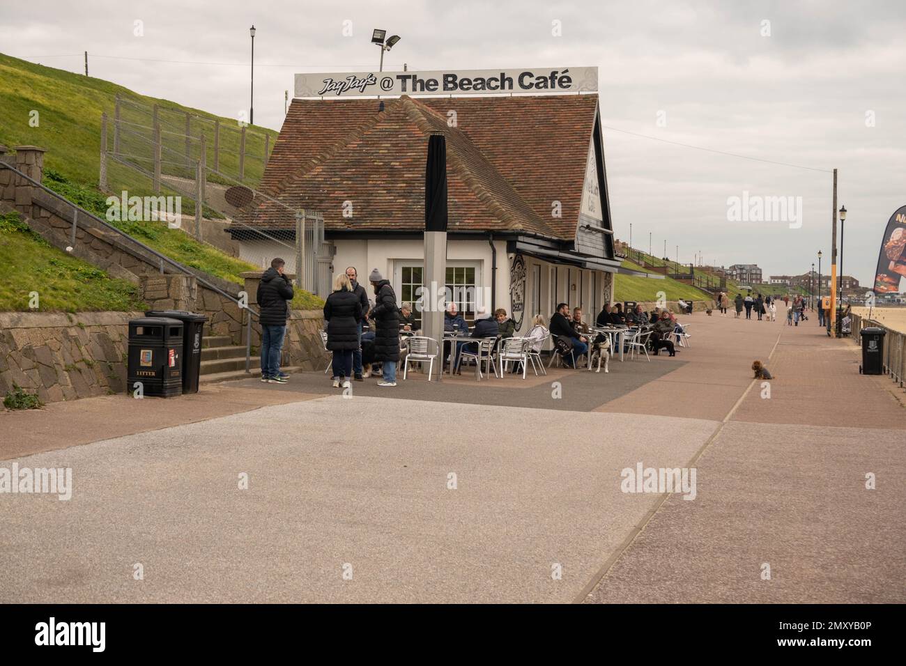 Beach cafe on Gorleston promenade busy with dog walkers sitting outside