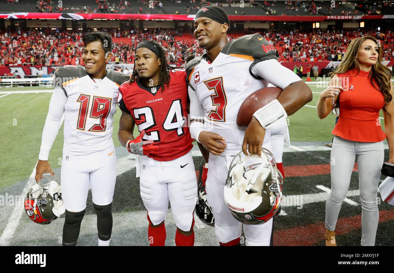 Tampa Bay Buccaneers kicker Roberto Aguayo (19) Atlanta Falcons running  back Devonta Freeman (24) and Tampa Bay Buccaneers quarterback Jameis  Winston (3) poses for a photo after the second half of an