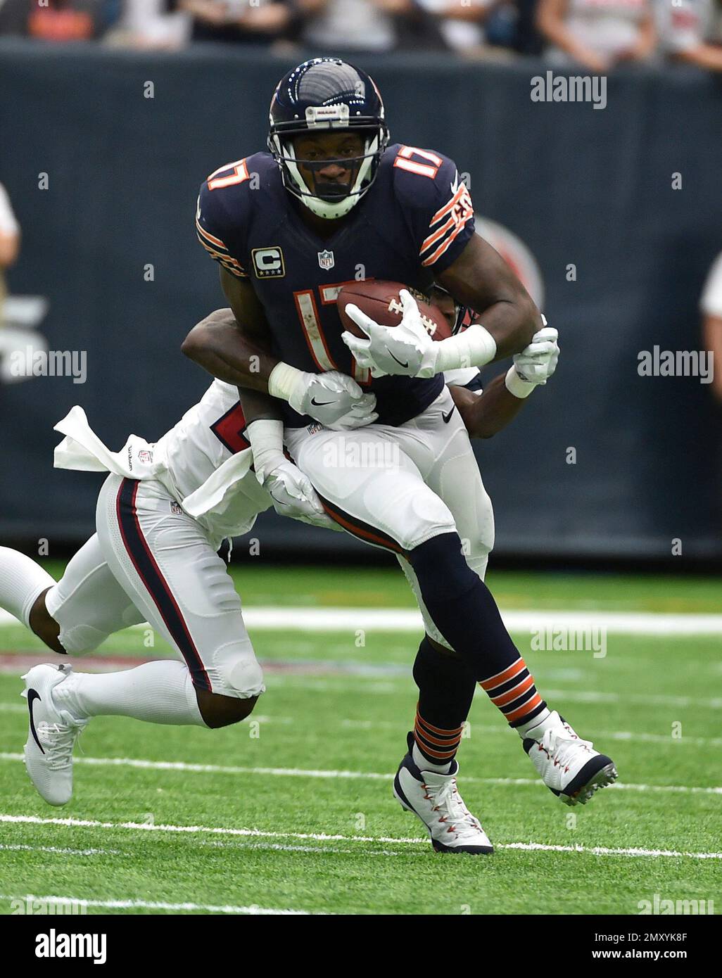 Seattle Seahawks linebackers Heath Farwell (55) and Korey Toomer (59)  tackle Chicago Bears wide receiver Alshon Jeffery (17) in the fourth  quarter of a pre-season game at CenturyLink Field in Seattle, Washington