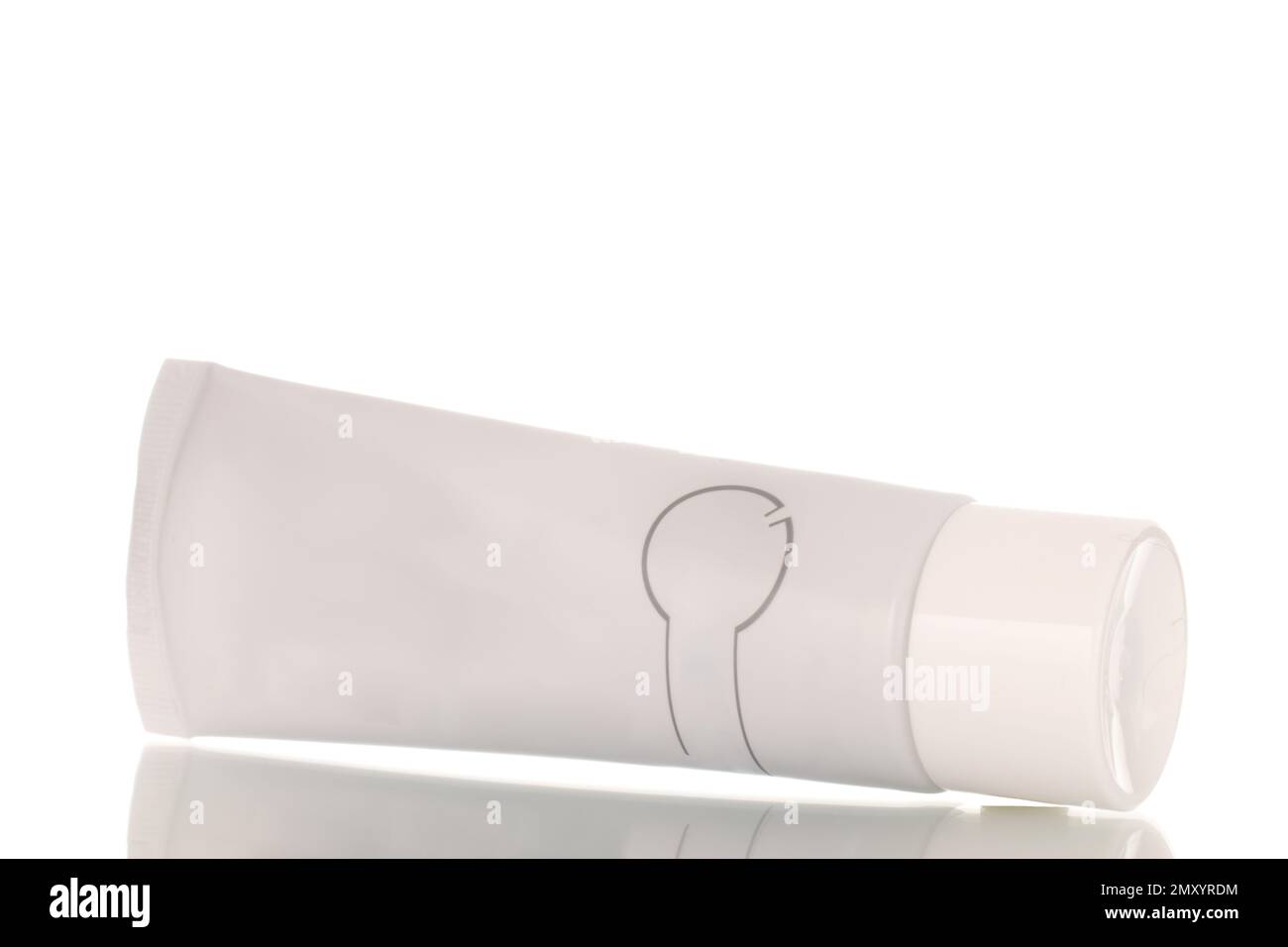 Oral care products, toothpaste in a plastic container, macro, isolated