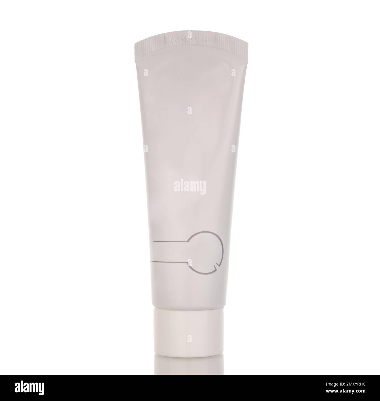 Oral care products, toothpaste in a plastic container, macro, isolated