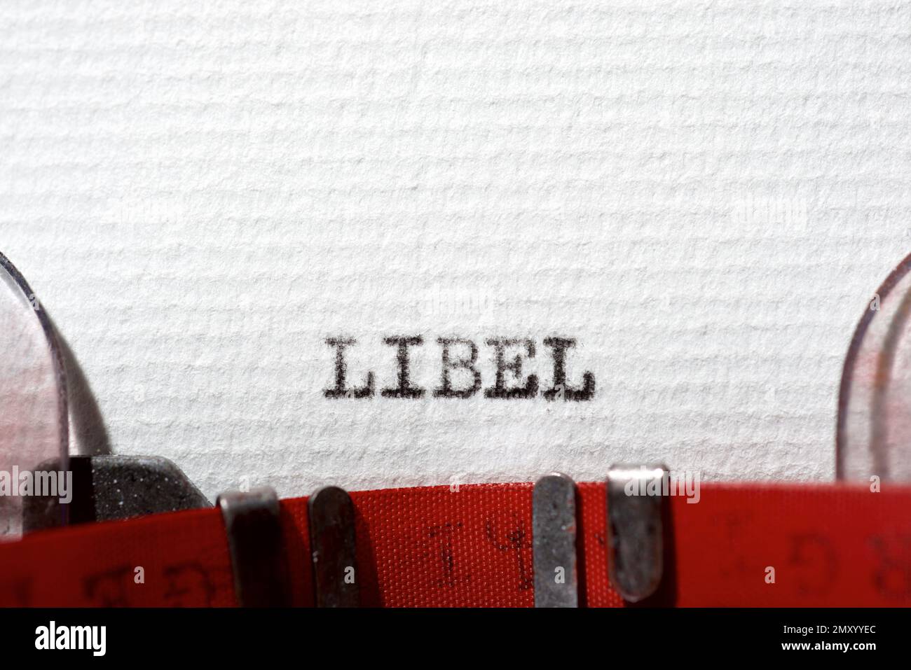 Libel word written with a typewriter Stock Photo - Alamy