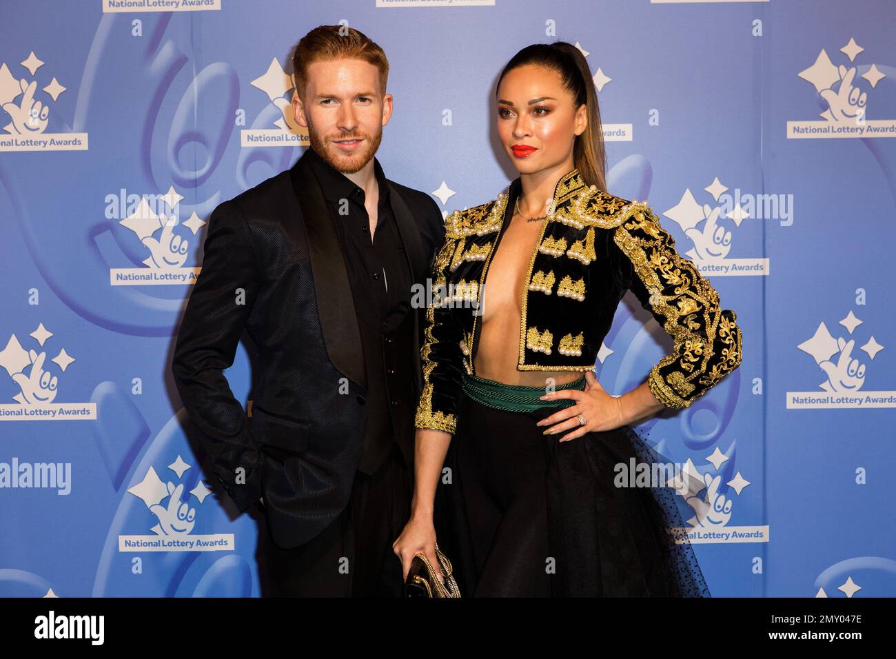 Dancers Neil and Katya Jones pose for photographers upon arrival at the