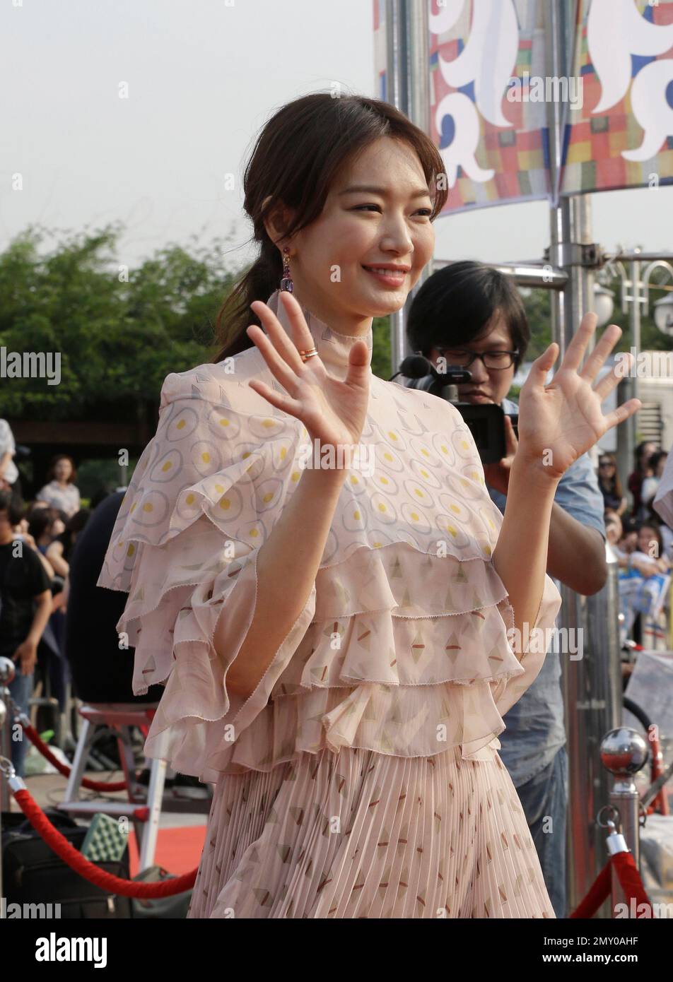 South Korean actress Shin Min-a wave as she arrives to attend the Seoul ...