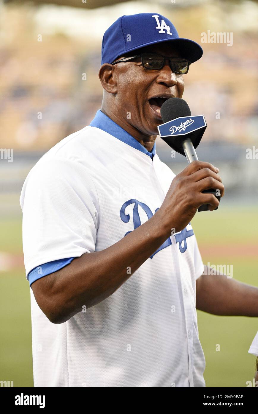 Former Los Angeles Rams running back and Pro Football Hall of Famer Eric Dickerson talks to the crowd prior to a baseball game between the Los Angeles Dodgers and the San Diego