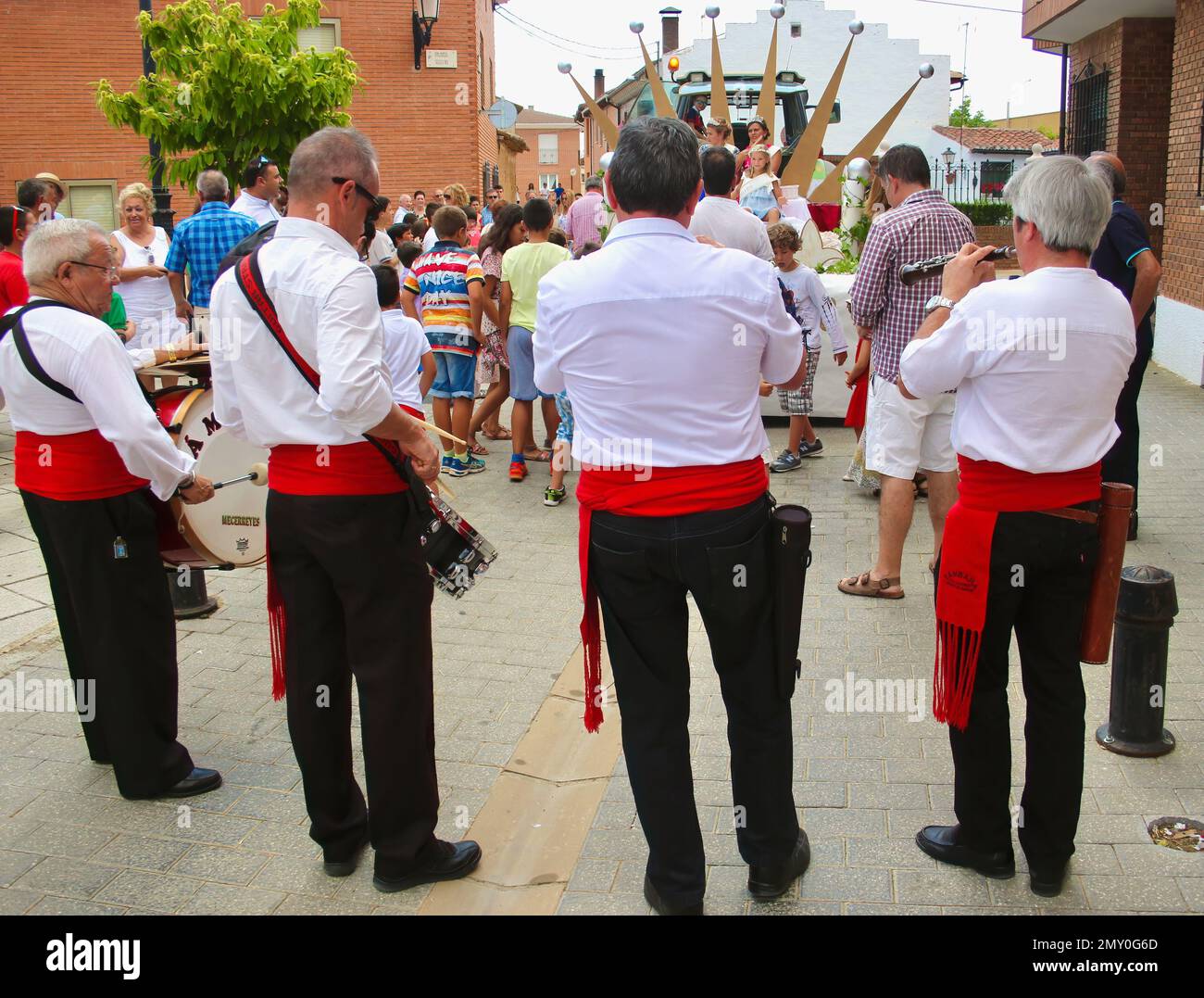 Village party queens on a float with a four piece band playing during the annual Assumption of the Virgin Mary 15 August celebrations Lantadilla Spain Stock Photo