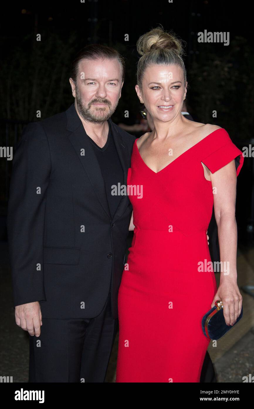 Actor Ricky Gervais and partner partner Jane Fallon pose for
