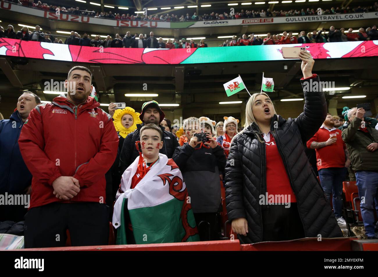 Wales fans sing the national anthem in the stands before the Guinness ...