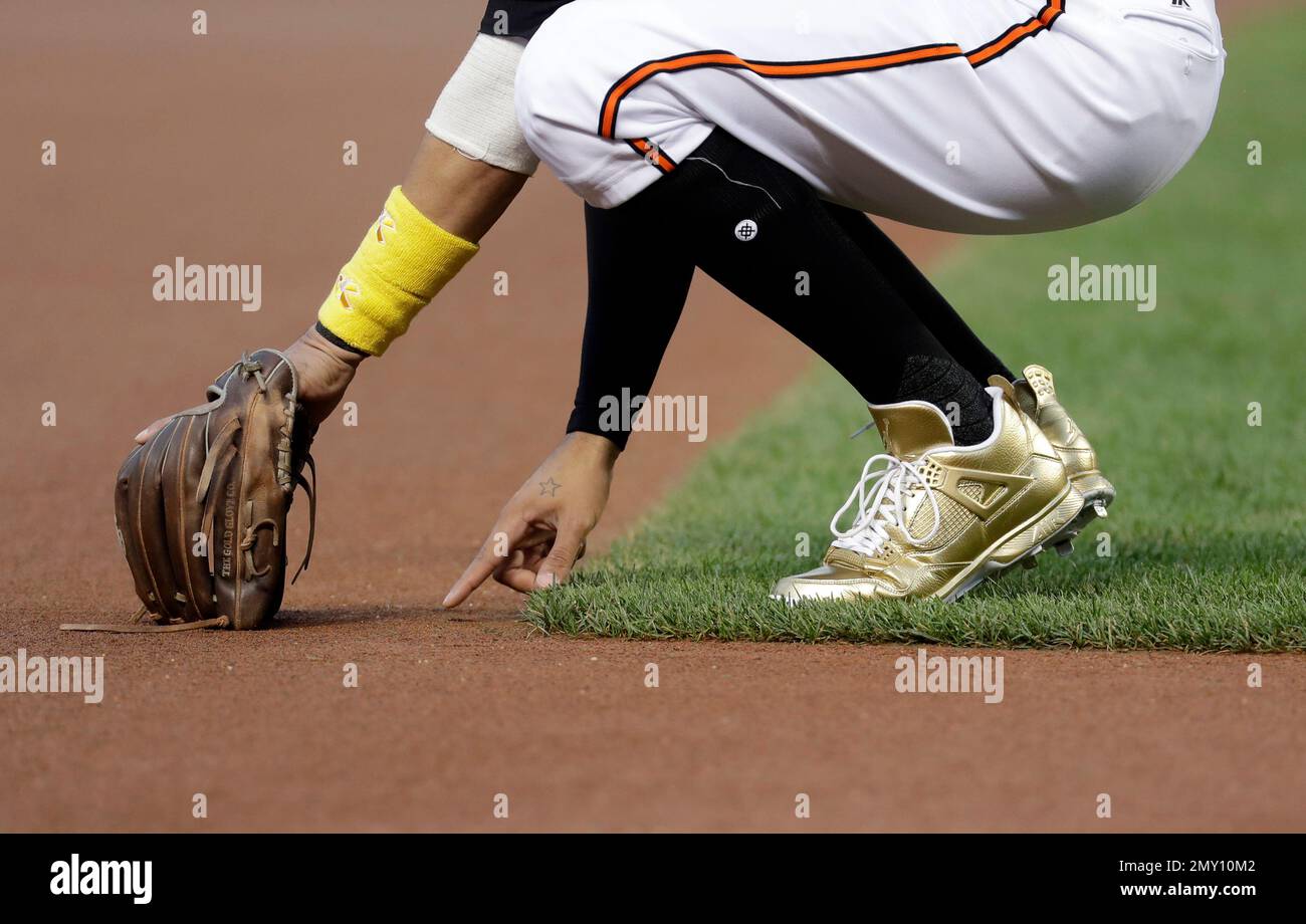 Baltimore Orioles third baseman Manny Machado writes in the