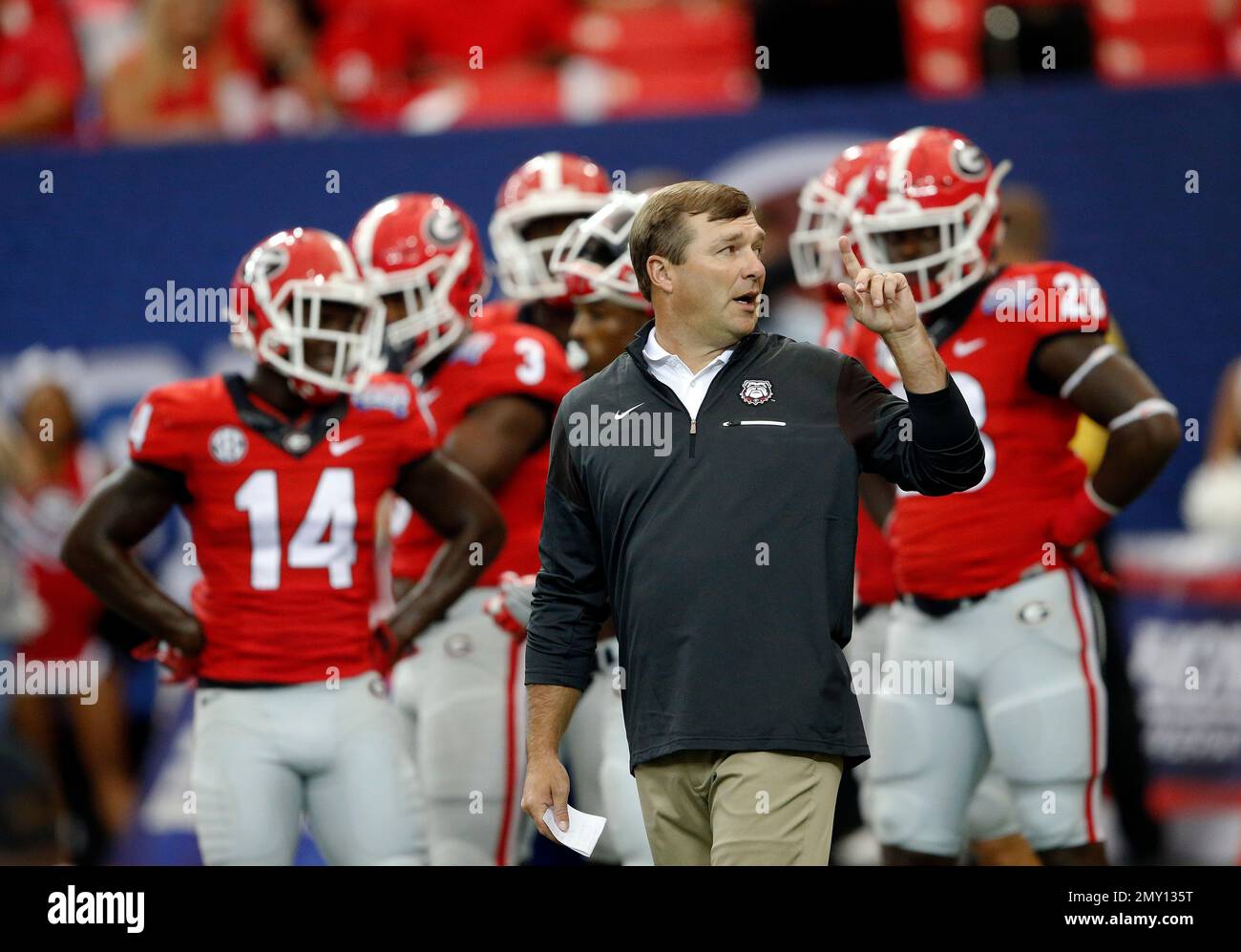 Georgia head coach Kirby Smart looks on as his team warms up before an ...