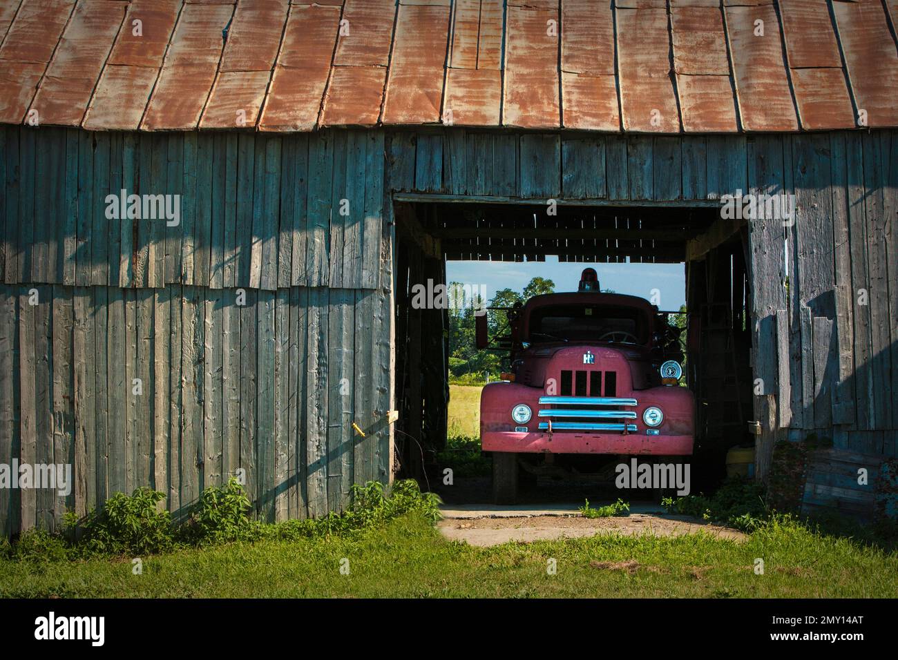 Old fire truck in a barn in Grand Isle, Vermont. Stock Photo