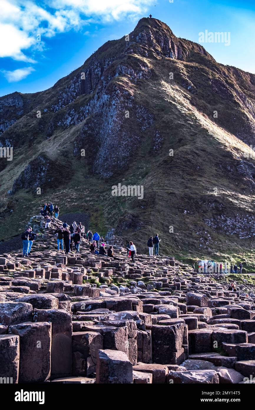 GIANT'S CAUSEWAY, NORTHERN IRELAND, UK - NOVEMBER 05 2022 : People enjoying the 40000 interlocking basalt columns. Stock Photo