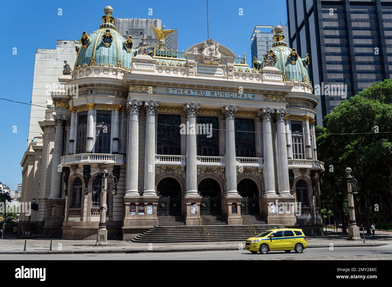 The main entrance and facade of Municipal Theater (Theatro Municipal) at Floriano square and Evaristo da Veiga street under summer morning clear sky. Stock Photo