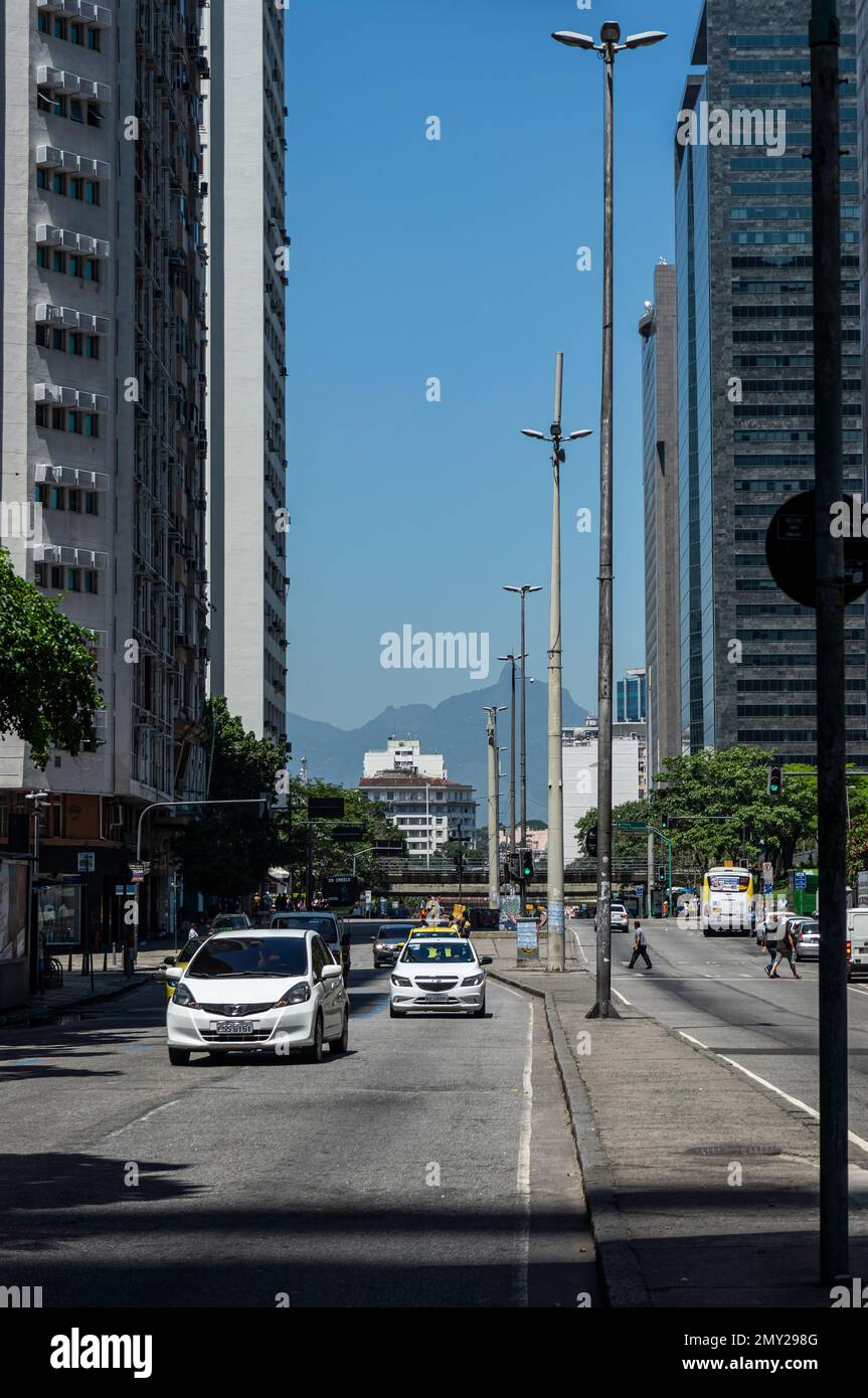 Oncoming traffic passing by Almirante Barroso avenue in Centro district as saw from the median strip of the avenue under summer morning clear blue sky Stock Photo