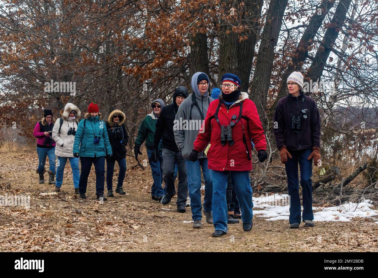 Group of birdwatchers on a hike in the winter at Big Marine Park