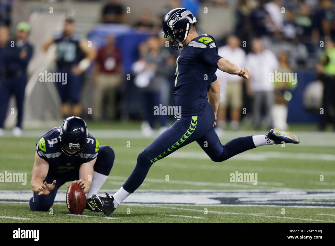 Seattle Seahawks kicker Steven Hauschka, right, kicks a field goal as