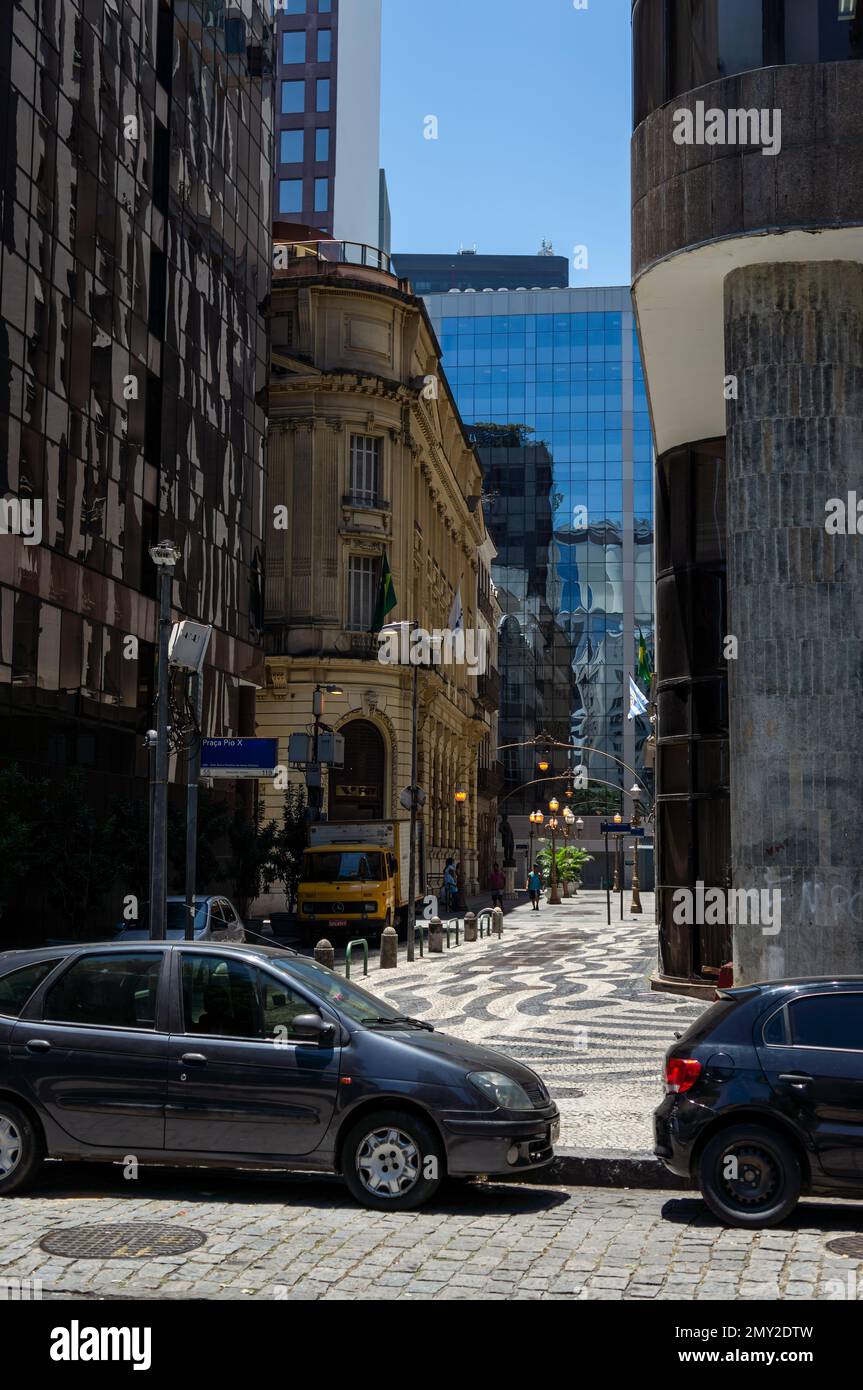 View of the narrow Candelaria street with partial view of yellow Getulio Vargas Foundation building at the back under summer sunny clear blue sky. Stock Photo