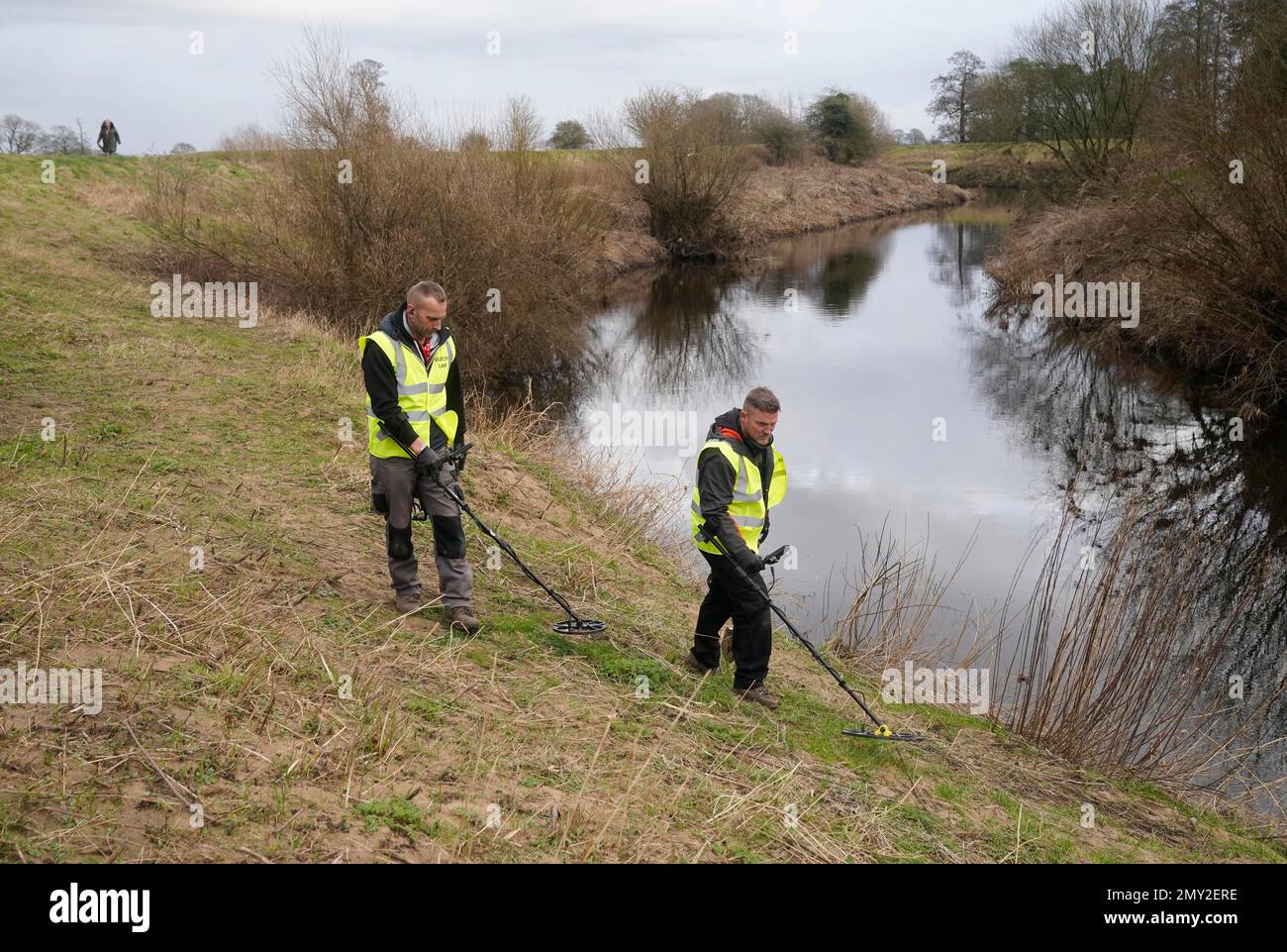 Members of the public use metal detectors on the banks of the River Wyre at St Michael's on Wyre, Lancashire, as the search continues for missing woman Nicola Bulley, 45, who was last seen on the morning of Friday January 27, when she was spotted walking her dog on a footpath by the nearby River Wyre. Picture date: Saturday February 4, 2023. Stock Photo