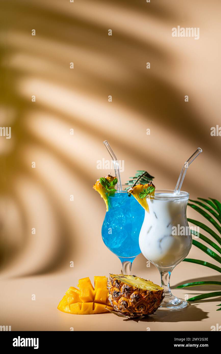 Set of summer classic tropical alcoholic cocktails on light background
