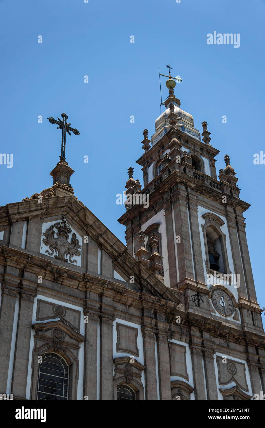 Partial facade and left tower view of Candelaria church located in Centro district, at Presidente Vargas avenue under summer afternoon clear blue sky. Stock Photo