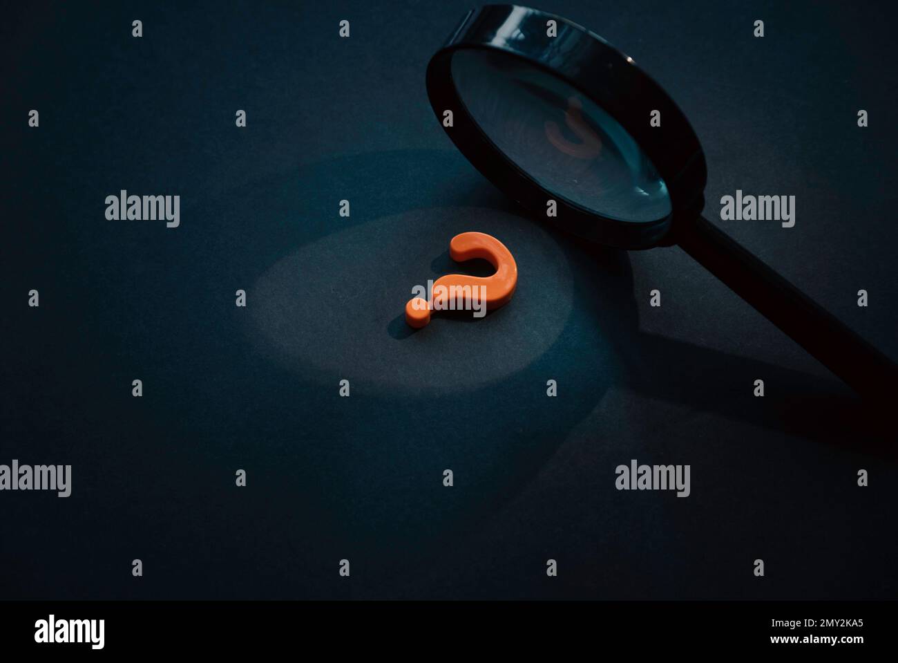 Questions and answers concept. Question symbol and magnifying glass on