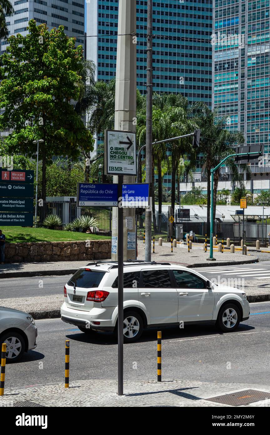 Traffic passing by the corner of Republica do Chile avenue with Lelio Gama street in Centro district nearby Petrobras building in a summer sunny day. Stock Photo