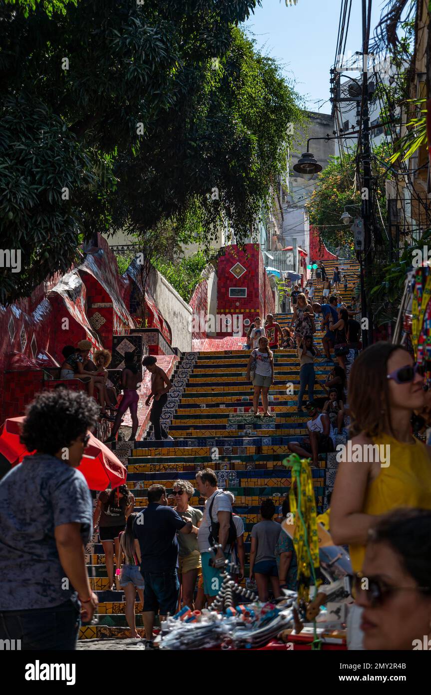 Opposite view at the lower section of colorful tiles decorated Selaron Steps nearby Joaquim Silva street under summer afternoon sunny clear blue sky. Stock Photo