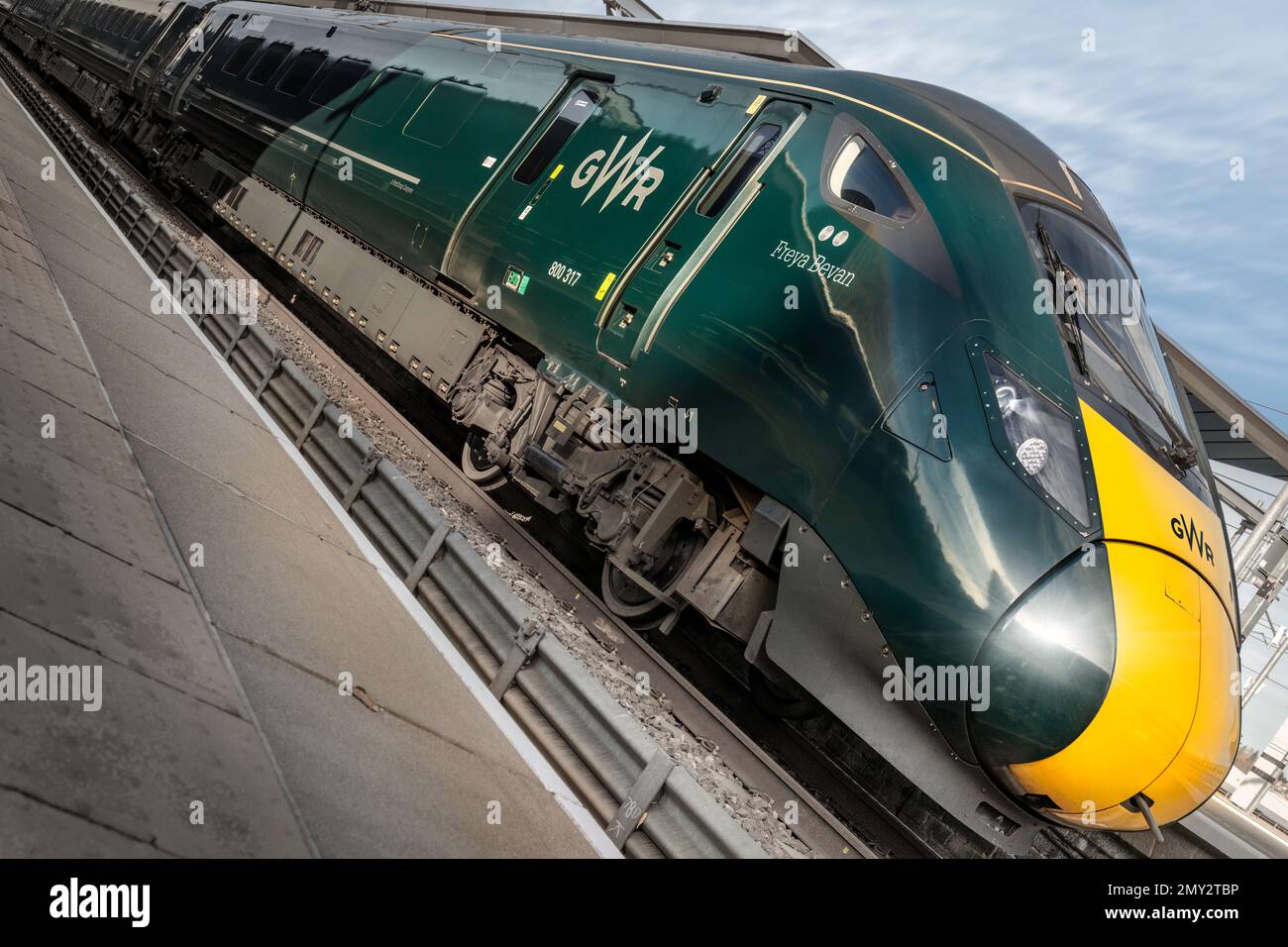 Great Western 'Freya Bevan' Class 802 Locomotive pulls into the platform at Reading Station in Berkshire. Stock Photo