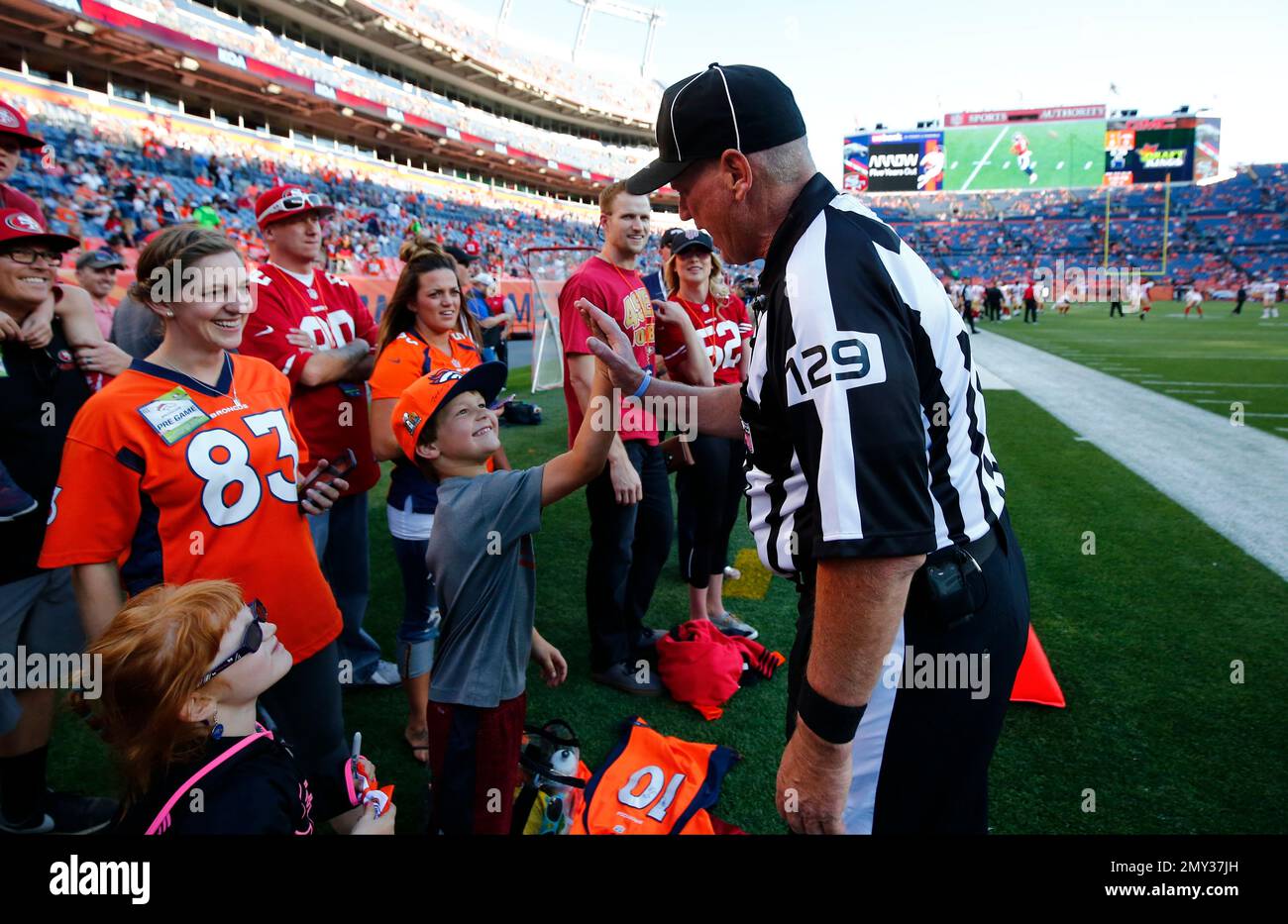 nfl-football-official-bill-schuster-right-high-fives-a-young-fan-before-a-preseason-nfl-football-game-between-the-denver-broncos-and-the-san-francisco-49ers-saturday-aug-20-2016-in-denver-ap-photojack-dempsey-2MY37JH.jpg