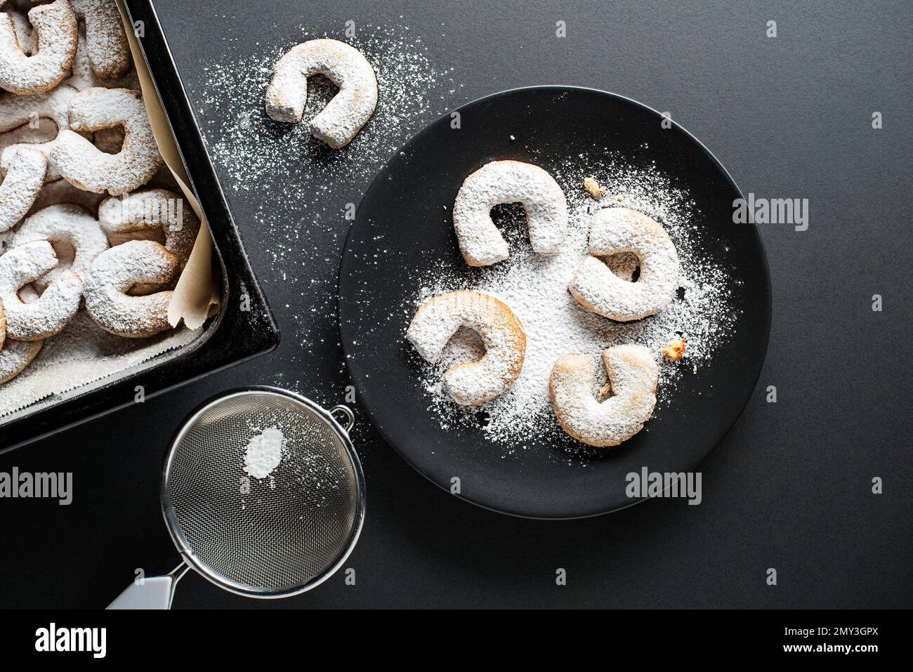 Baking Traditional vanilla crescents cookies and powdered with castor