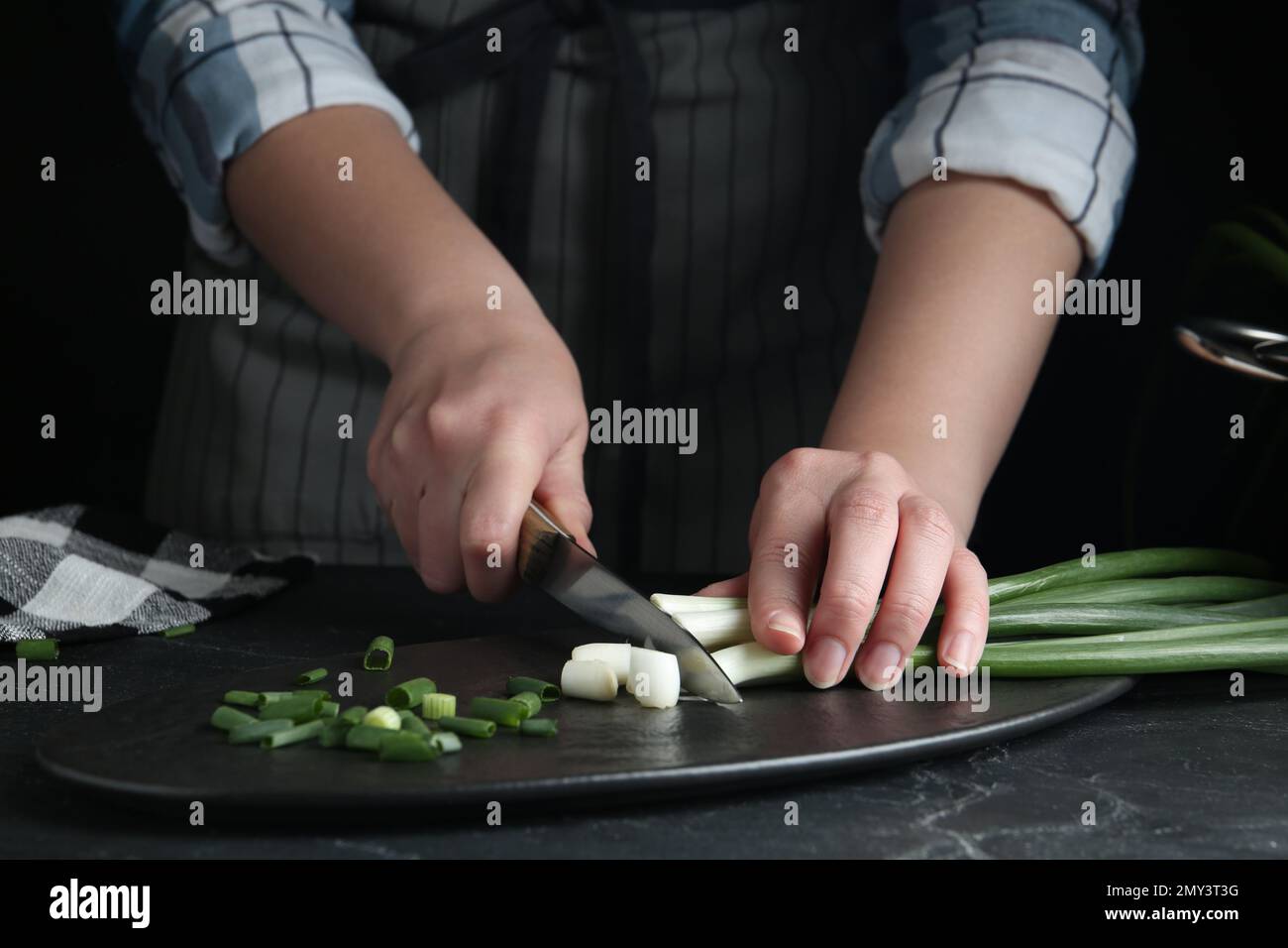 Woman cutting onions hi-res stock photography and images - Alamy