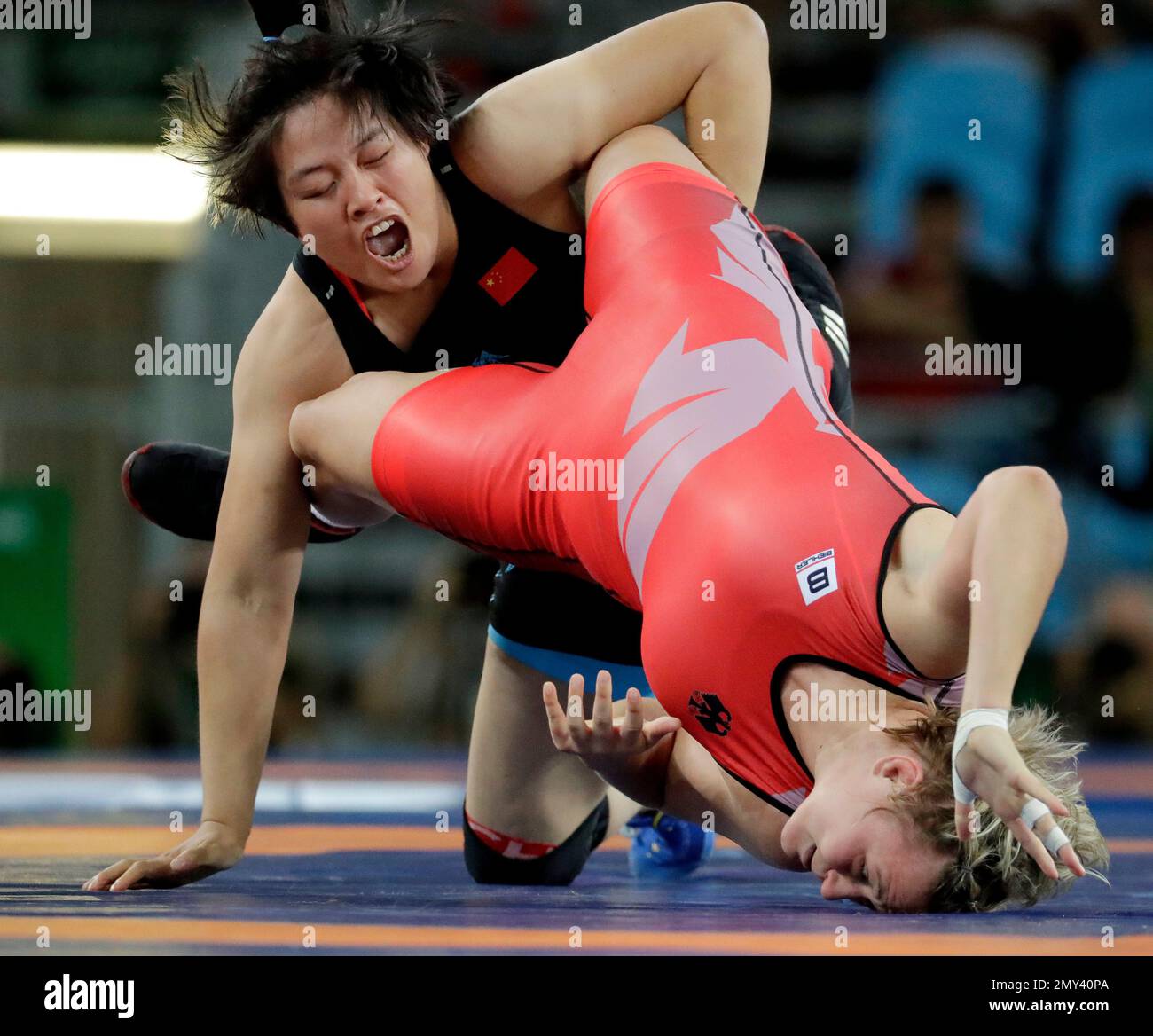 Germanys Maria Selmaier, right, and Chinas Zhang Fengliu compete during the womens wrestling freestyle 75-kg