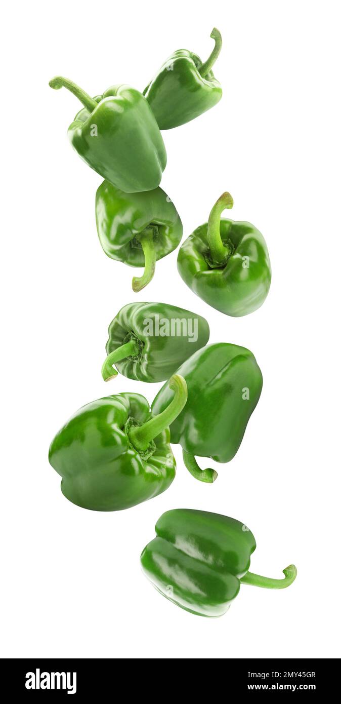Fresh green bell peppers falling on white background Stock Photo Alamy
