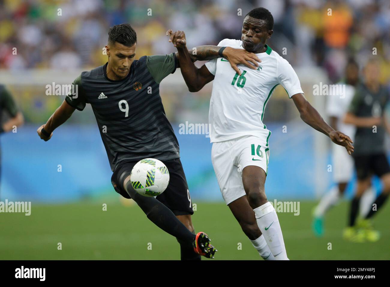 Germany's Davie Selke, left, and Nigeria's Stanley Amuzie vie for the