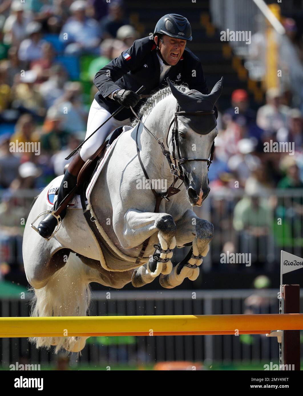 France's Philippe Rozier, riding Rahotep De Toscane, competes in the equestrian jumping