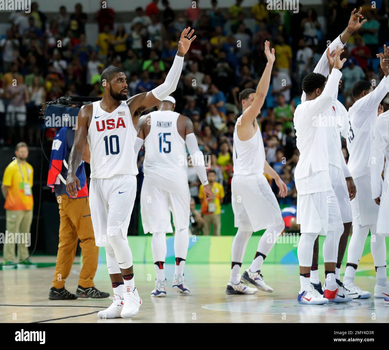 FILE - In this Aug. 14, 2016, file photo, United States' Kyrie Irving (10)  celebrates with teammates after a basketball game against France at the  2016 Summer Olympics in Rio de Janeiro,
