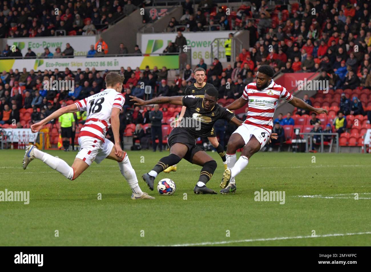 Doncaster, UK. 04th Feb, 2023. Hartlepool United's Josh Umerah shoots at goal only for Doncaster Rovers Ro-Shaun Williams to block the shot during the Sky Bet League 2 match between Doncaster Rovers and Hartlepool United at the Keepmoat Stadium, Doncaster on Saturday 4th February 2023. (Credit: Scott Llewellyn | MI News) Credit: MI News & Sport /Alamy Live News Stock Photo