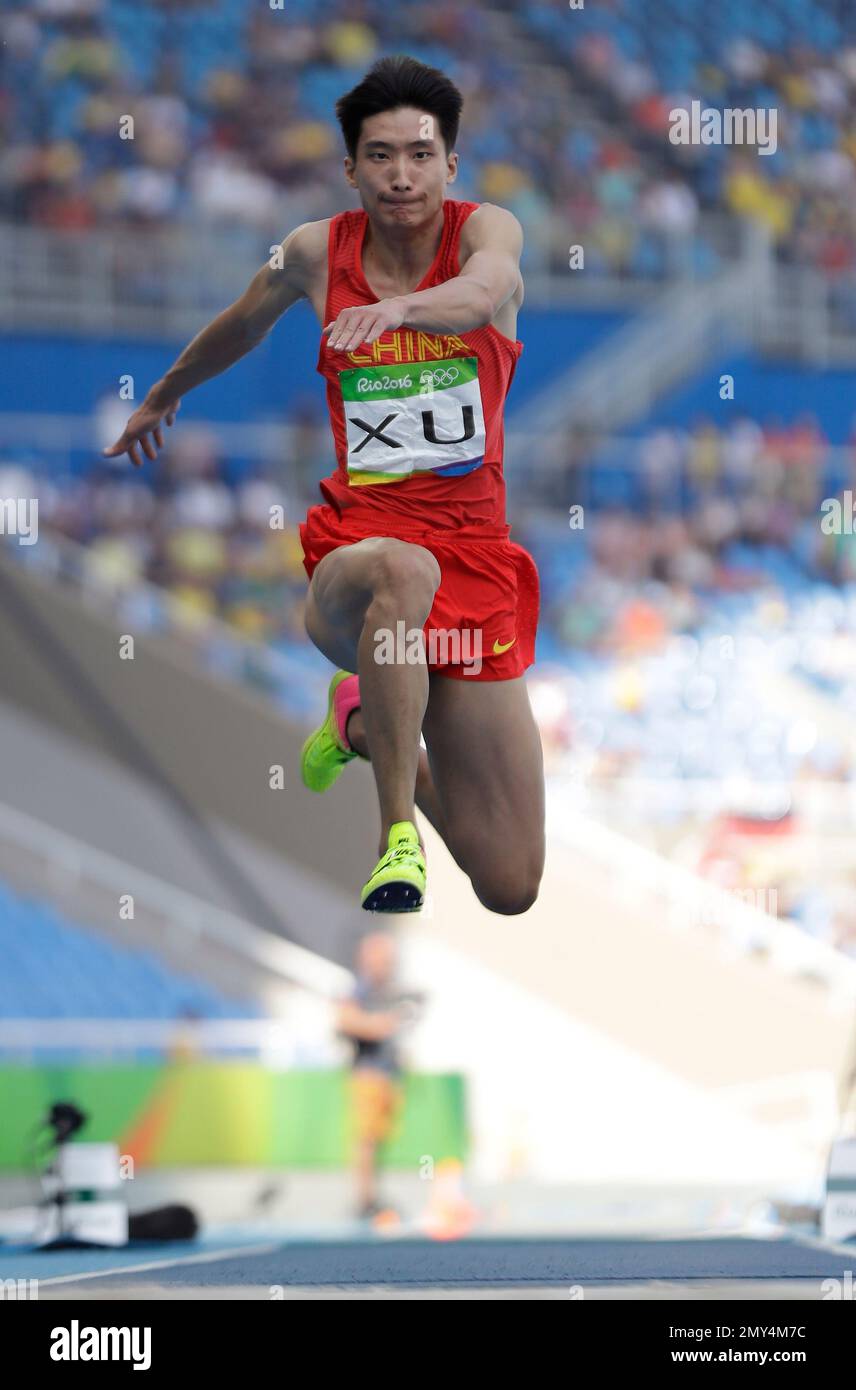 China's Xu Xiaolong makes an attempt in the men's triple jump final ...