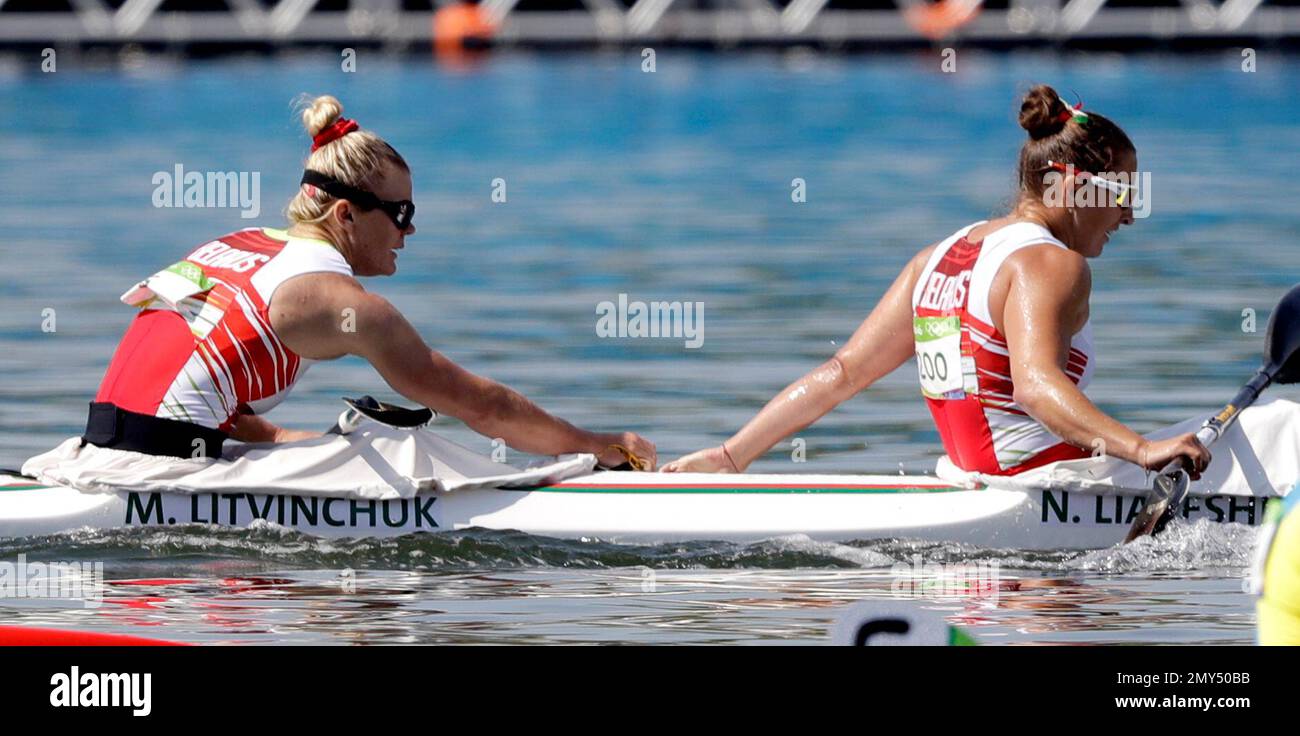 Belarus' Maryna Litvinchuk and Nadzeya Liapeshka rest after the women's kayak double 500m