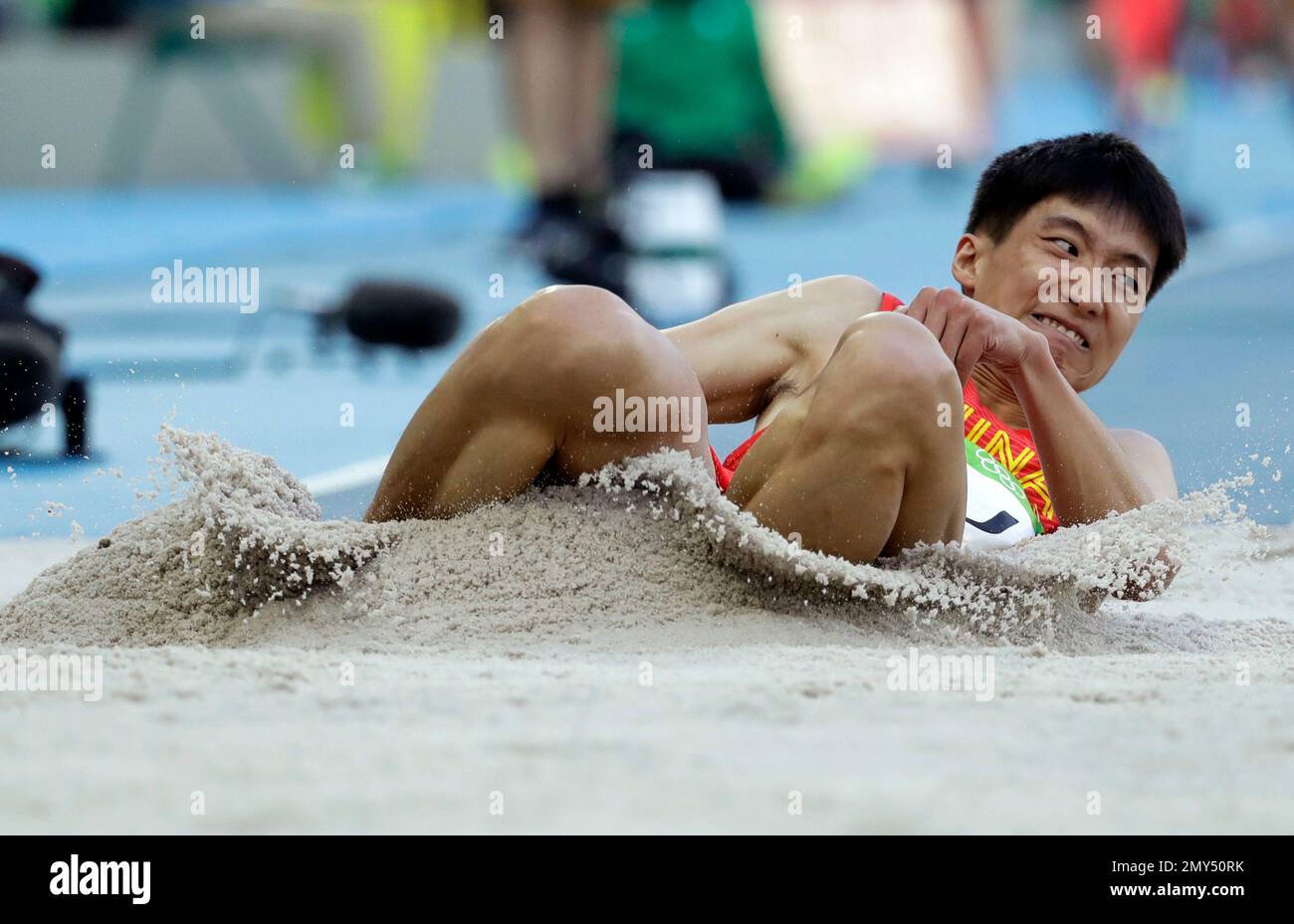 China's Xu Xiaolong makes an attempt in the men's triple jump ...