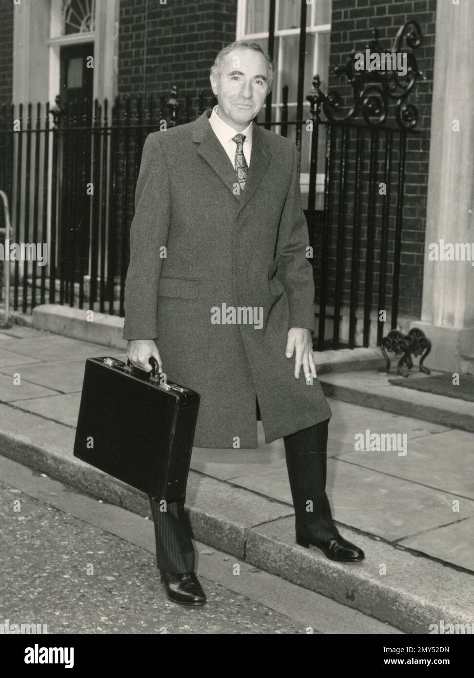 Actor Nigel Hawthorne as Sir Humphrey Appleby outside 10 Downing Street, London UK 1980s Stock Photo
